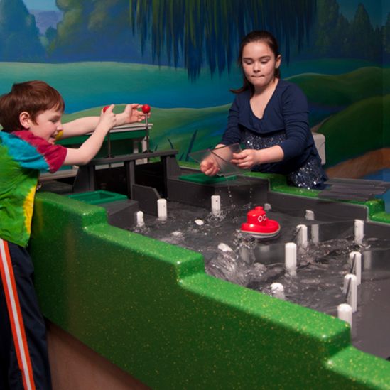 children playing with the sluiceway
